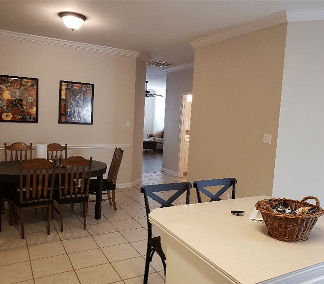 Kitchen and dining area looking towards living room and hall bathroom