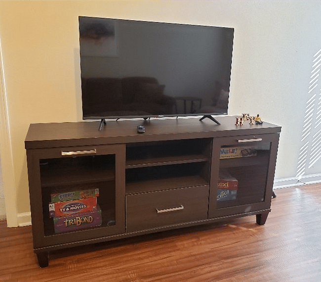 TV cabinet with storage and board games provided