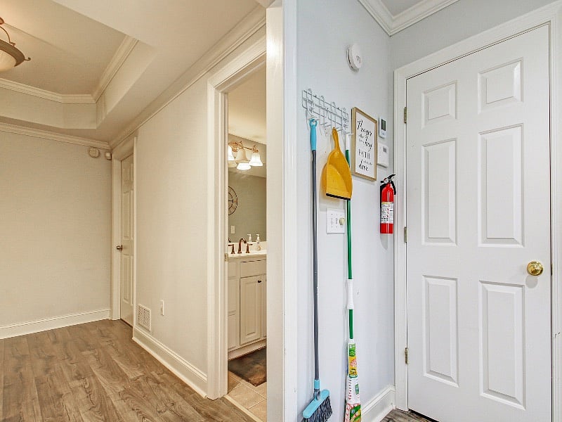 Hallway leading to bathroom and desk area...