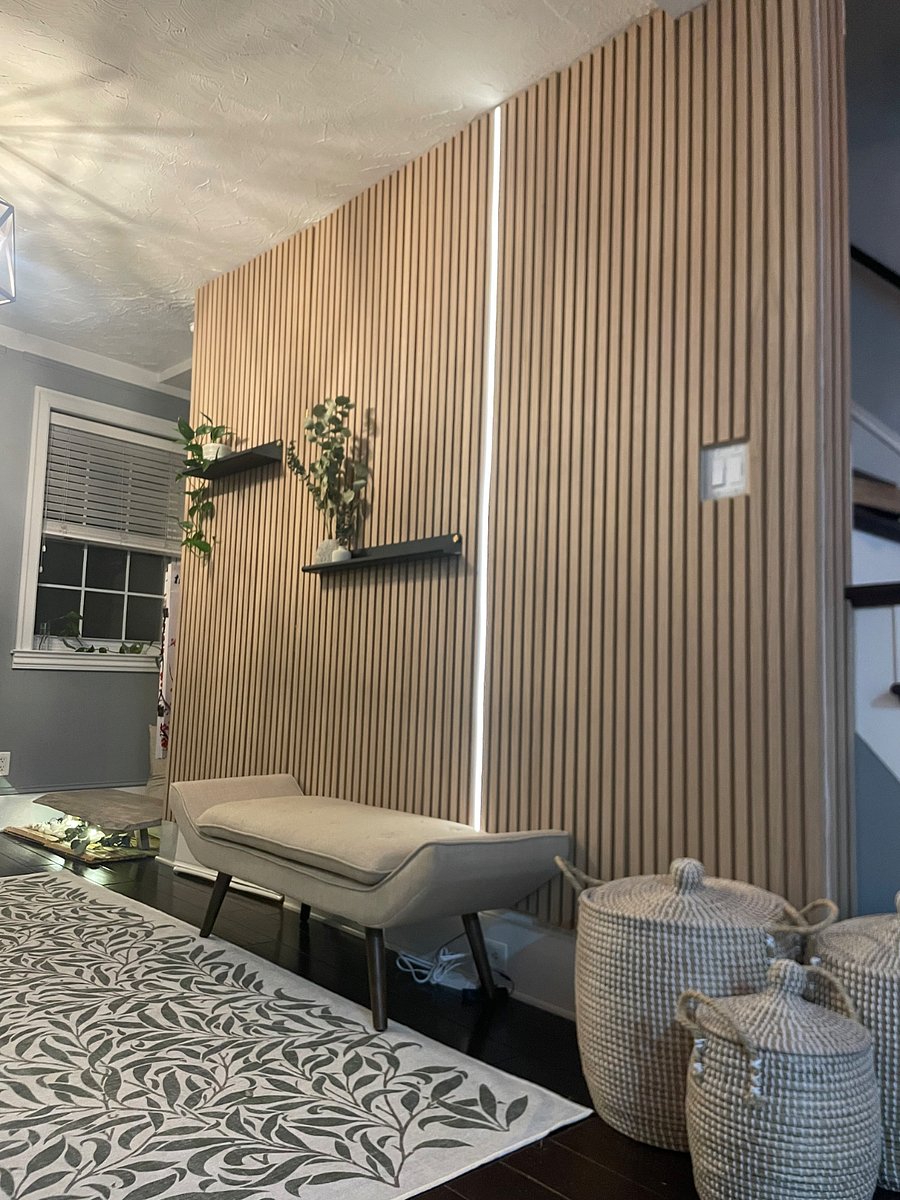 Recently added accent wall with shelves, lights, plants and eucalyptus to bring nature and spa vibes to the living space =)