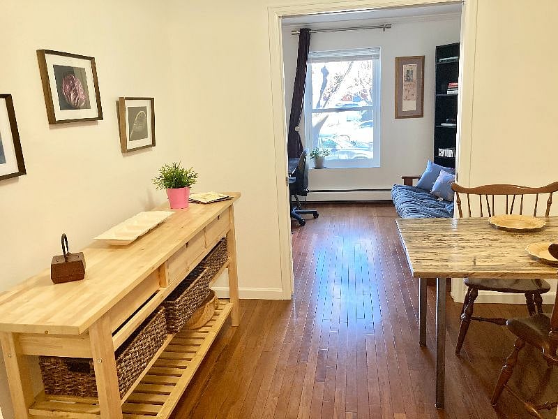 Dining area separates from second bedroom/office by double pocket doors.