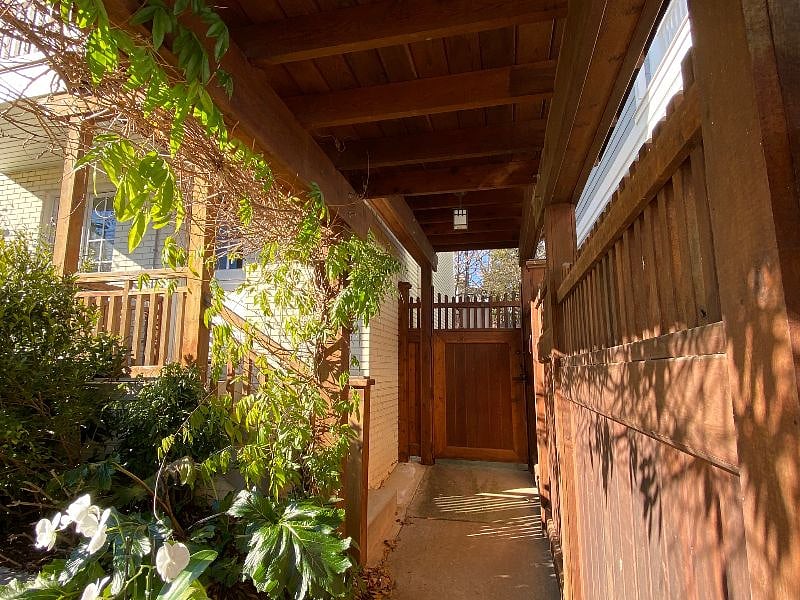 Entrance to studio apartment through locked gate into backyard. The backyard is used by my family and 2 children.