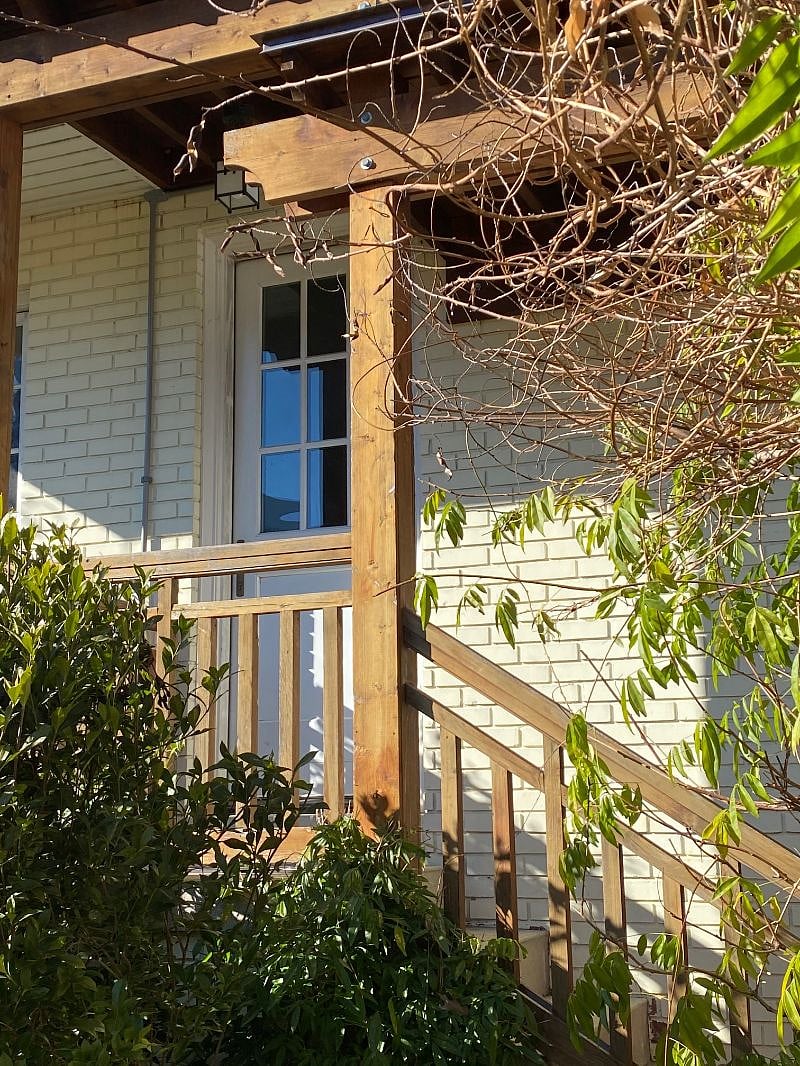 Shared entrance into garage. Carriage house entrance is a locked door within the garage.