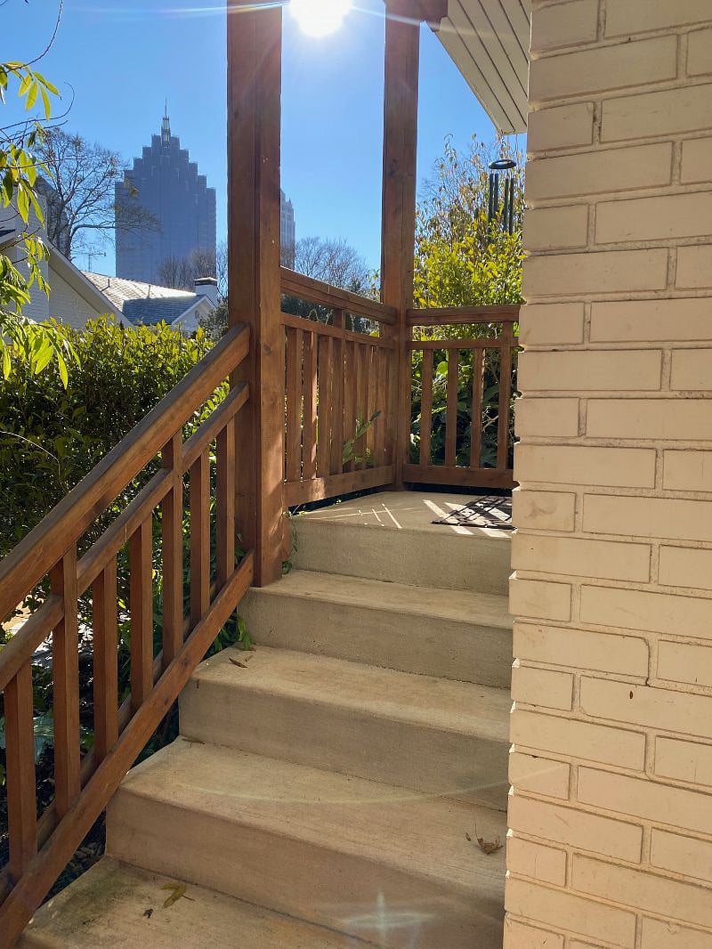 Shared entrance into garage with then private/locked entrance up to carriage house.