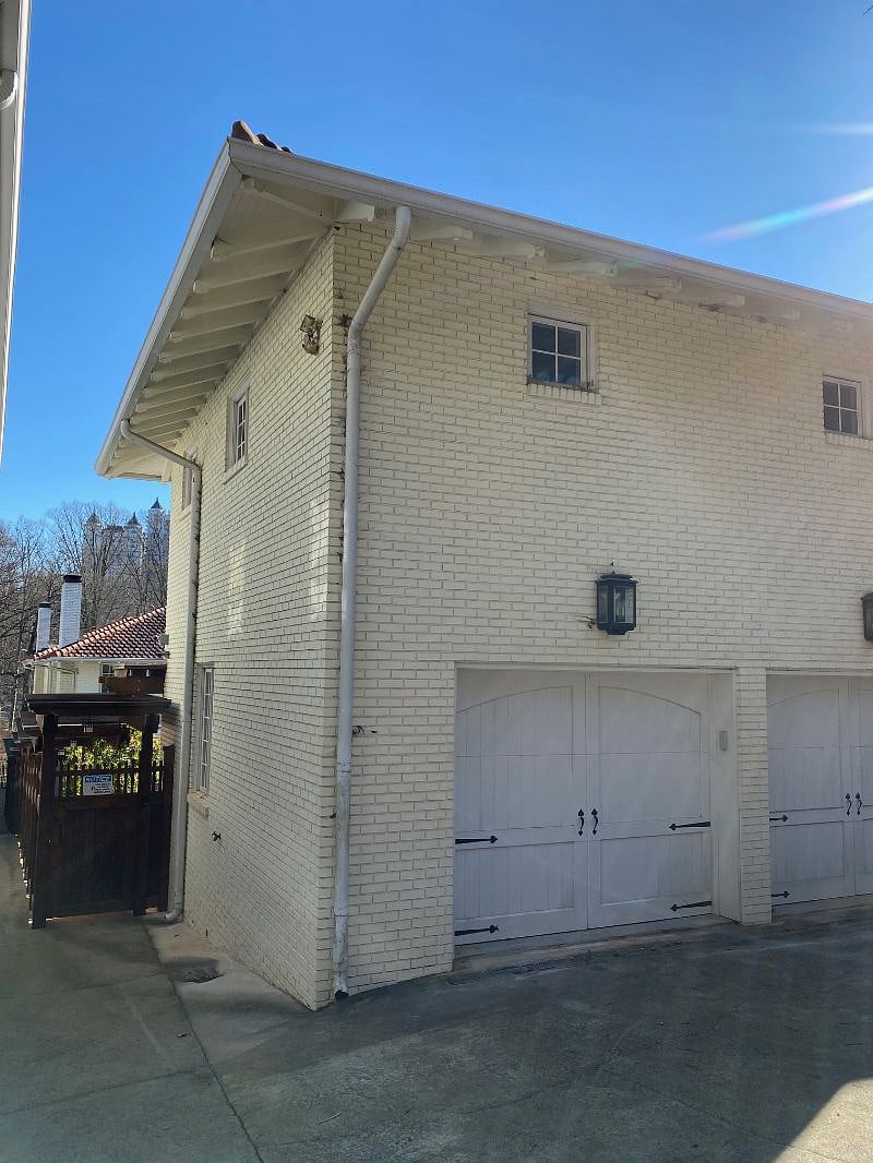 Carriage house over garage with adjacent entrance through back gate.