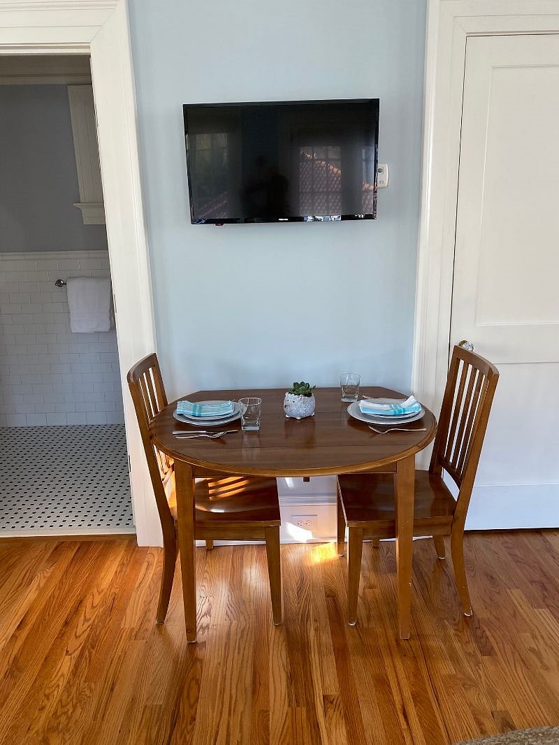 Sitting area for meals or work. TV adjusts for watching in bed or sitting area,.