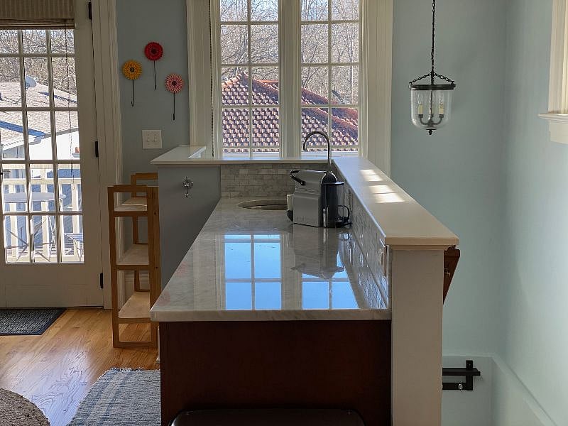 Kitchenette with microwave, fridge/freezer and Nespresso machine.
