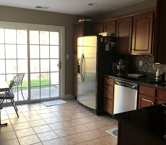 Full kitchen w/sliding doors to private patio.