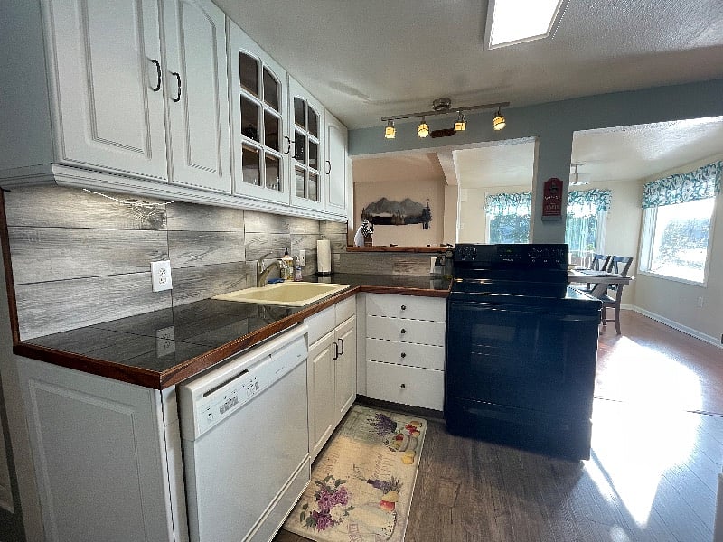 View from kitchen overlooking bar and onto the dining area
