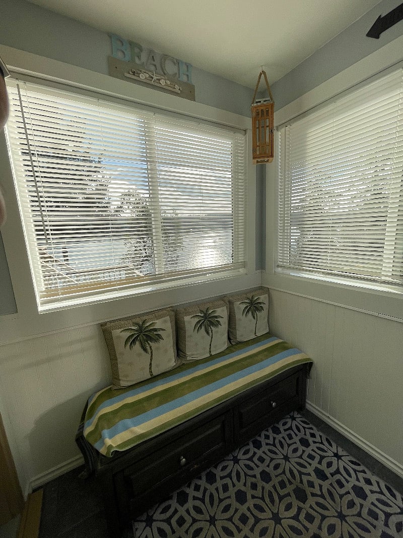 Sitting nook with storage drawers with view to water