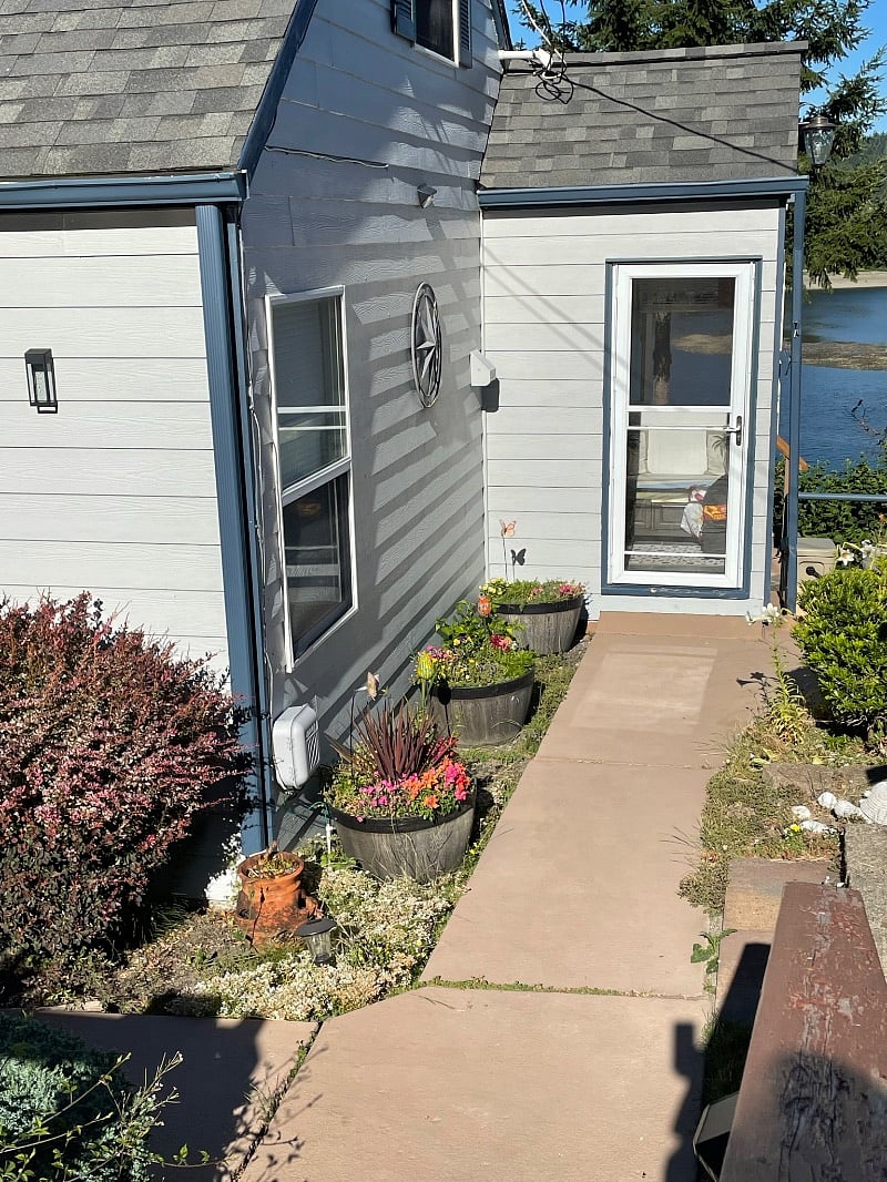 Primary bedroom left window and mudroom entrance