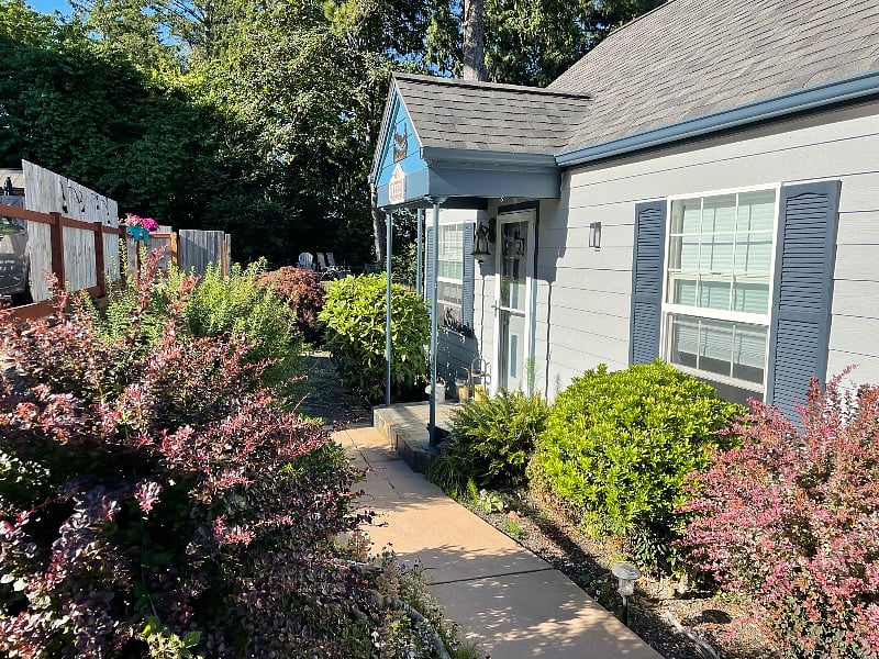 Front gardens and walkway that leads to beach stairs