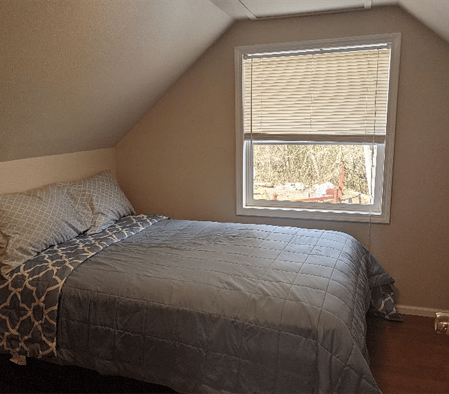 Upper secondary bedroom with full size bed