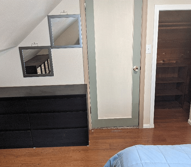 Upper secondary bedroom dresser, bedroom door and cedar lines closet