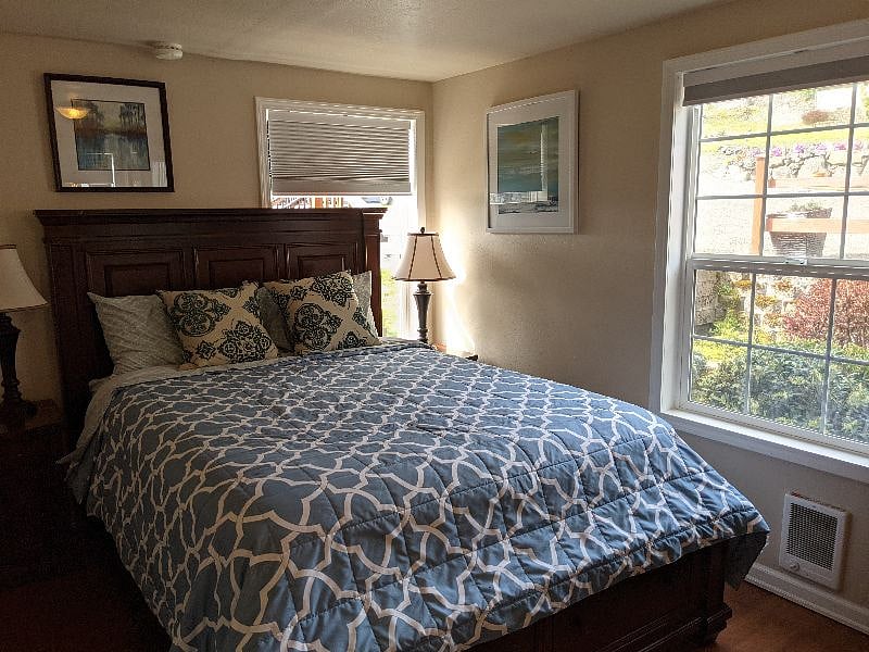 Primary bedroom with Queen bed and storage bedframe from Costco