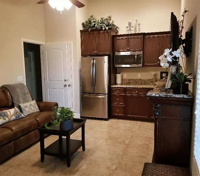 Private living room and kitchen with entrance to main house