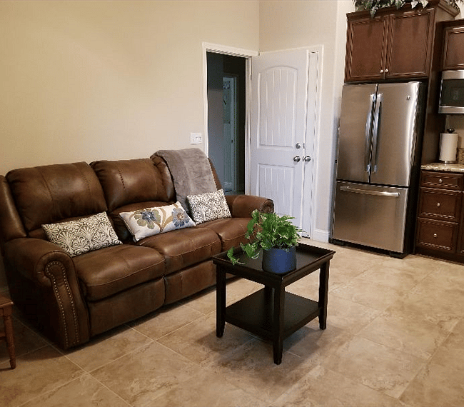 Private living room and kitchen with entrance to main house