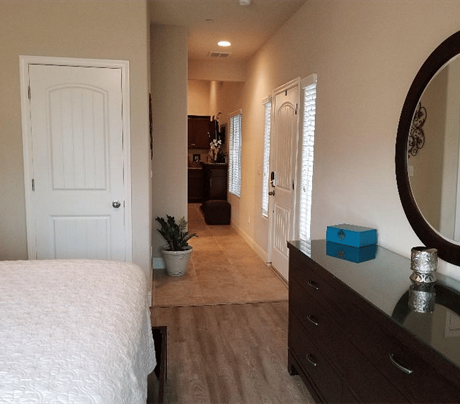 View from private suite bedroom to living room