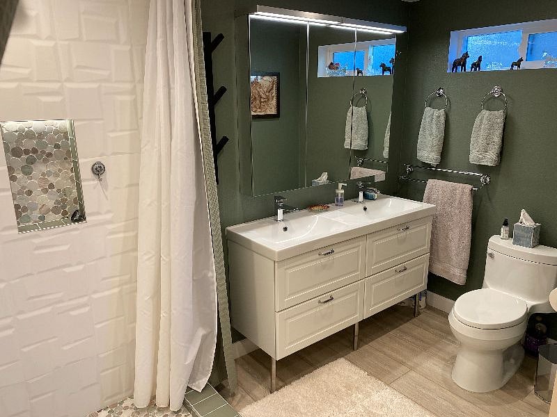 Large remodeled bathroom, double sink and plenty of cabinet and vanity storage. Towels provided