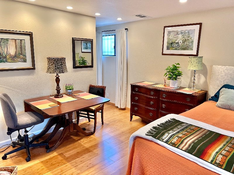 Hidden behind the table is a private hallway to your bathroom and walk in closet