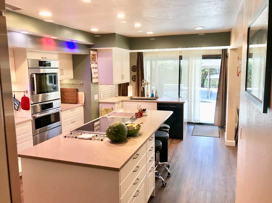 Kitchen leads to the backyard, counter seating
