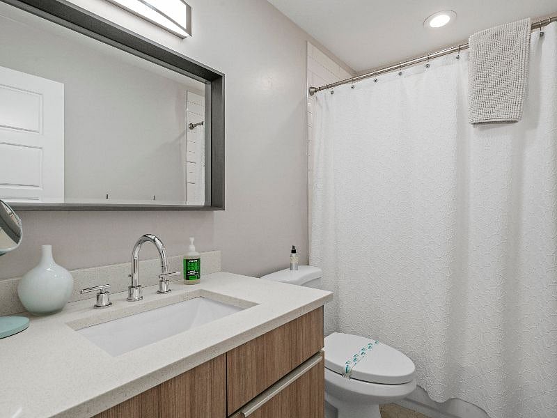 Guest bathroom on main level with tub