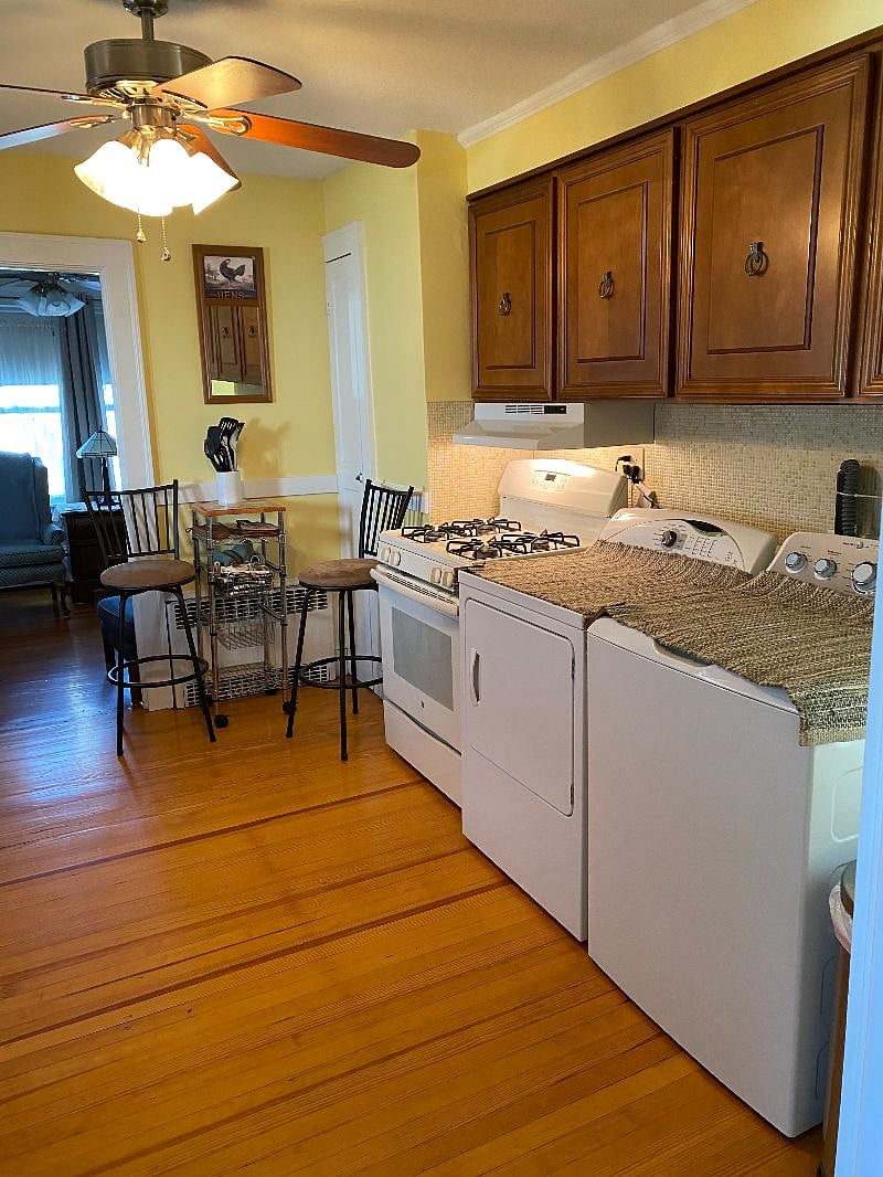 gas stove, vented and washer and dryer in kitchen