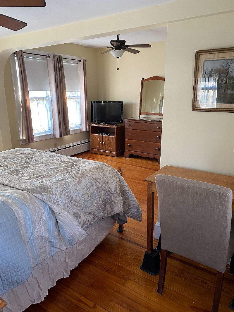 The bedroom has two dressers (not just the one shown in this photo.)  It also has a closet just outside of the room.  Two ceiling fans in this room