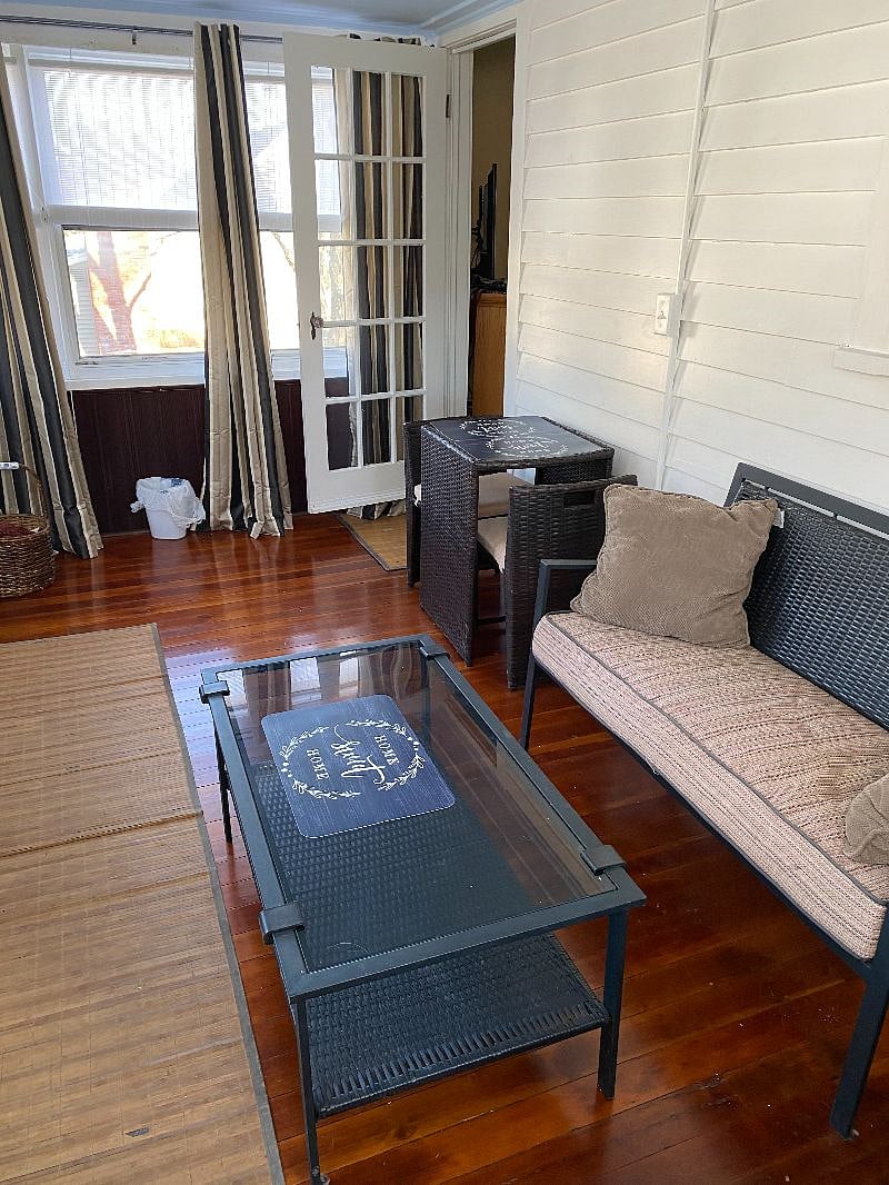three season porch of living room ...seating and dining options...