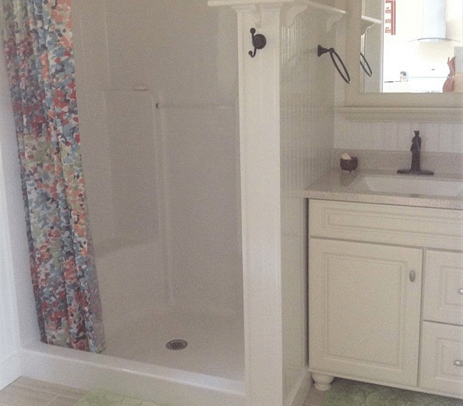 Good size shower and vanity with heated tile floor.