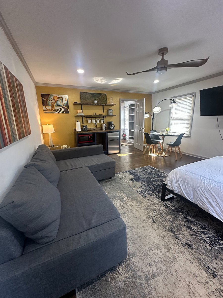 Downstairs bedroom comfort meets convenience  sofa, TV, kitchenette, and perfect for any moment.