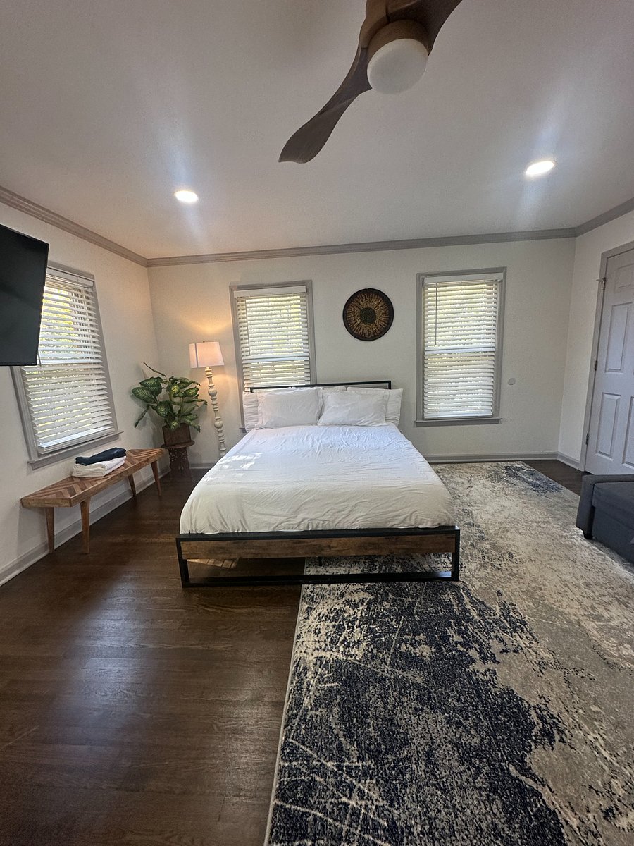 Relax in this cozy downstairs bedroom featuring a plush double bed and peaceful ambiance.