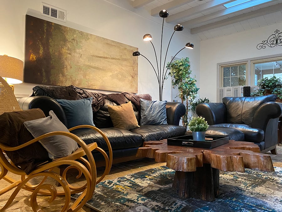 Brick, leather, and pure comfort  the perfect spot to unwind.