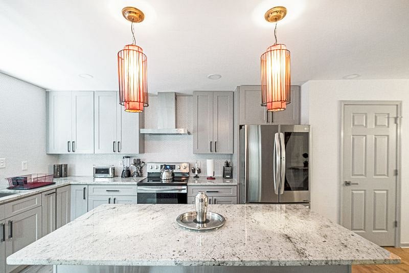 Chef-inspired kitchen featuring stainless steel appliances and clean, modern finished