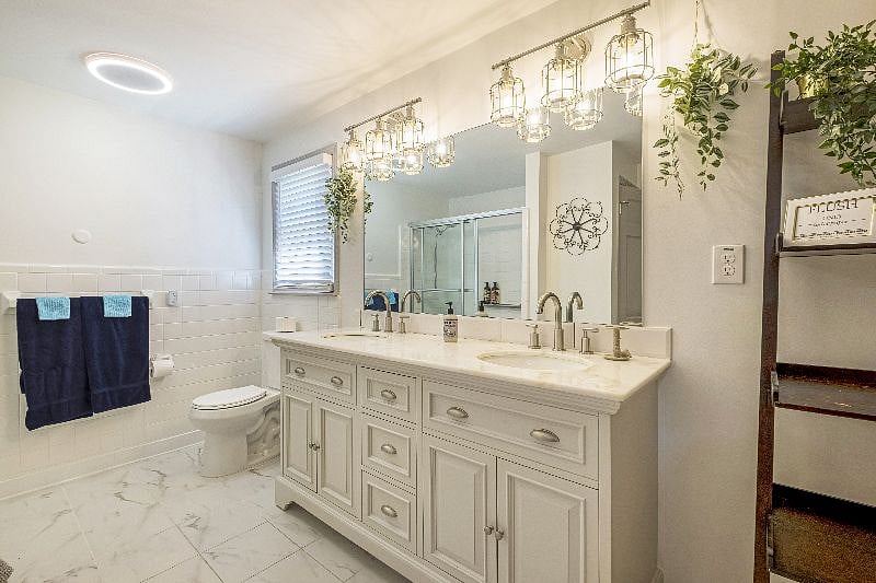 Spacious master bedroom featuring a private bathroom for ultimate convenience and luxury.