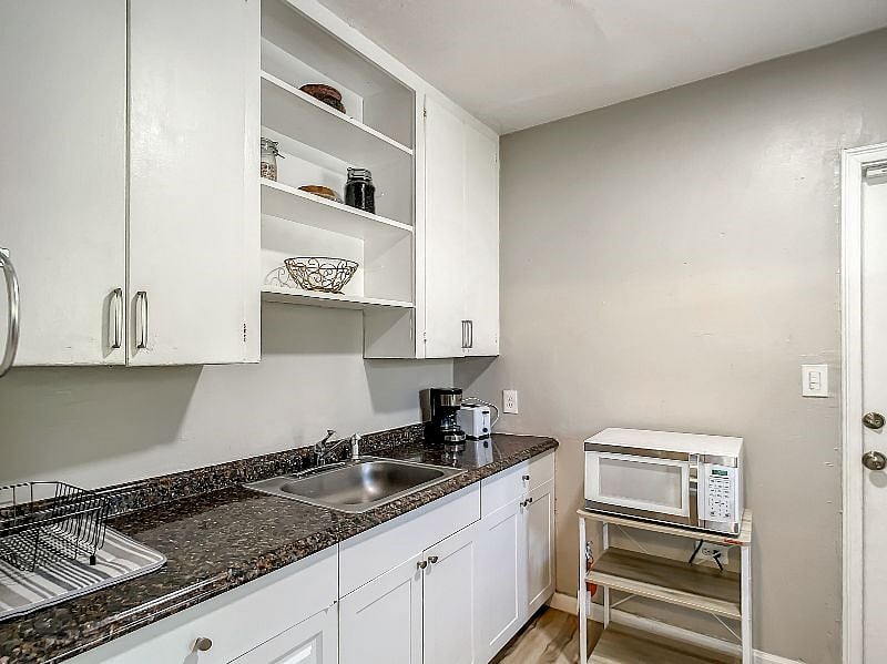 Lots of cabinet space and a cute counter! Cabinets reach all the way up into the ceiling so storage is never an issue!