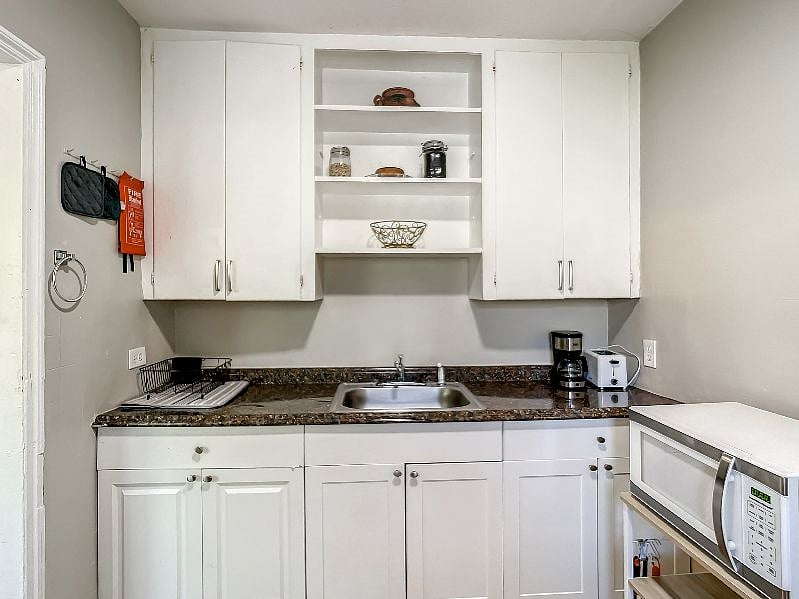 Take a full look. This is the original kitchen restored to keep it's vintage Olde Miami feel.