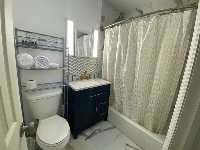 And finally, we have the fully remodeled bathroom, fully stocked with starter supplies like toiletries, linens, some first aid supplies, and towels!