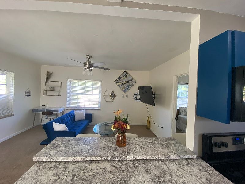 The dining counter top overlooks the living room for easy viewing access to your Smart Roku TV as you cook!