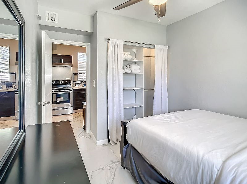 Here's a back view of Bedroom B, with a full view of the built-in closet organizer for all of your things!