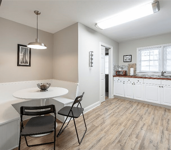Well appointed eat-in kitchen with washer dryer, microwave and everything else you need to enjoy a short or long stay. Door from the kitchen leads out to the shared patio with gas BBQ and outdoor seating area.