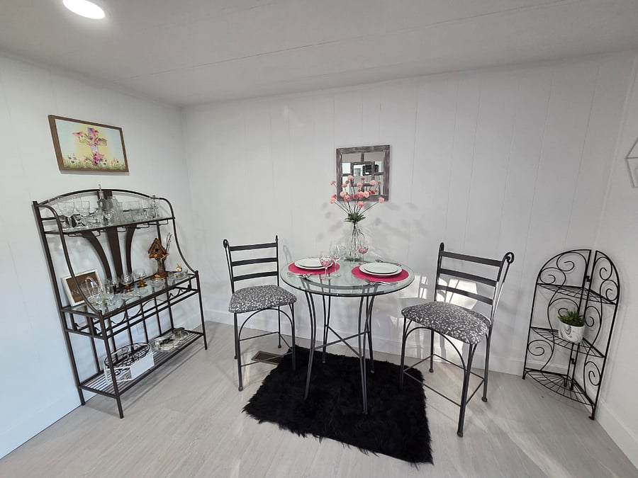 2 top bar table with buffet and plenty of glassware for your drinking enjoyment