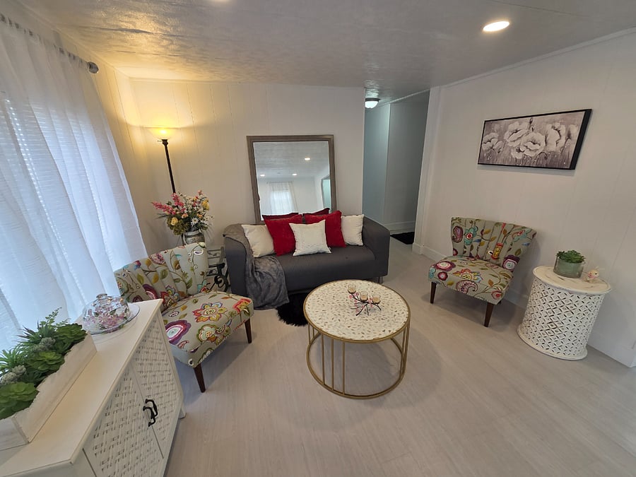 Living Room with couch and cute flower chairs