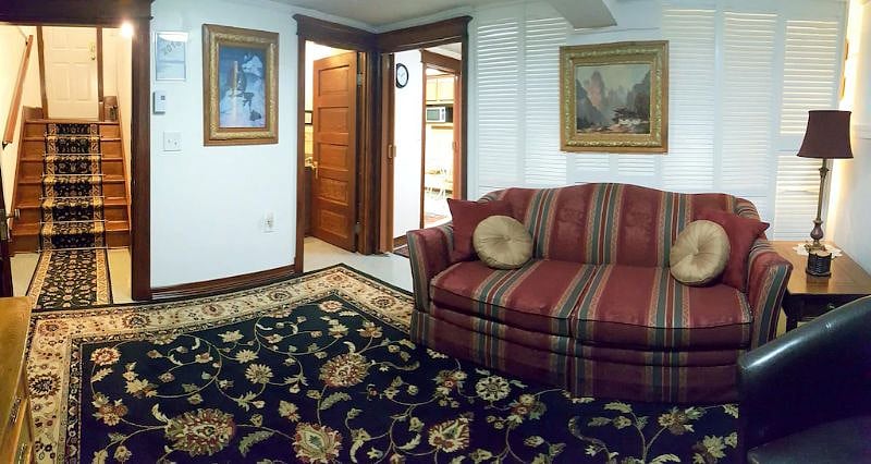 Entry stairs on left, bathroom through center door, then door to bedroom on right
