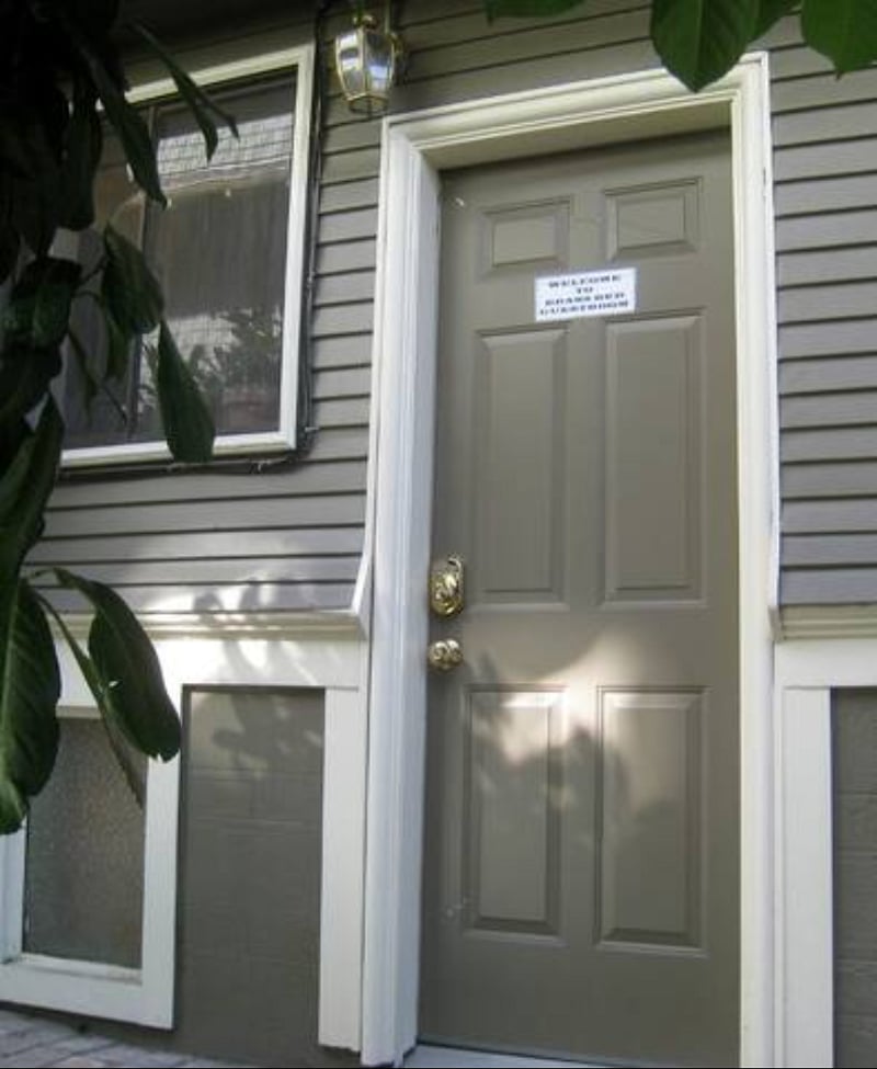 A private and secure entry door on north side of house, with electronic keypad and personalized access code, as well as motion sensor light above doorway