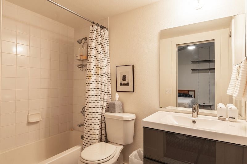 Downstairs bathroom connected to downstairs bedroom.