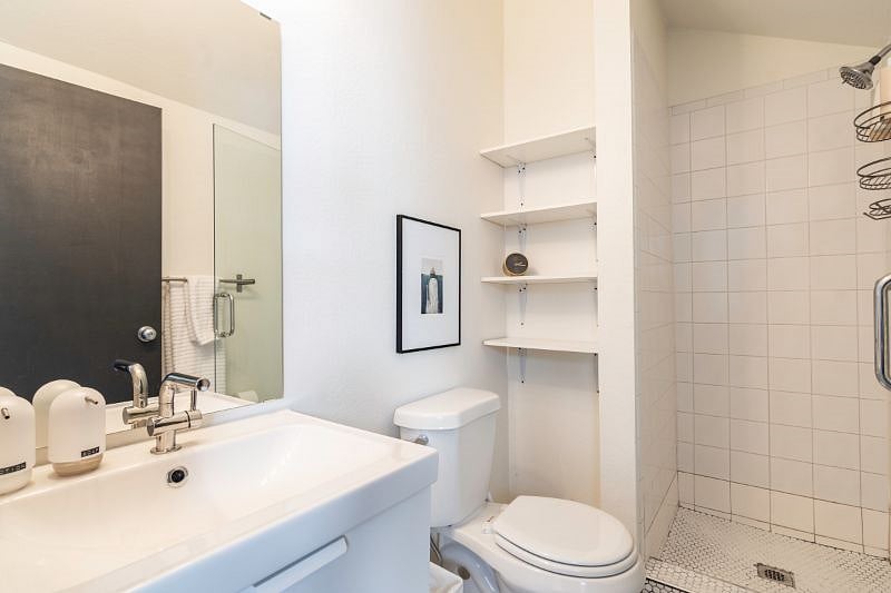 Upstairs bathroom off master bedroom with walk in shower.