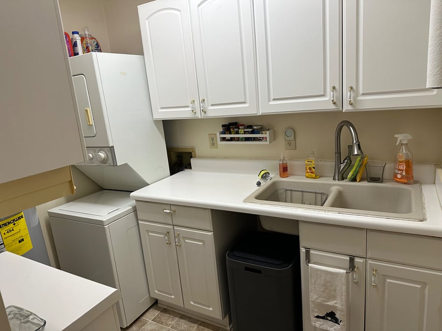 Large double sink and stack washer & dryer and nice large kitchen trash can.
