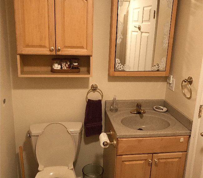 Master bathroom with plenty of shelves.