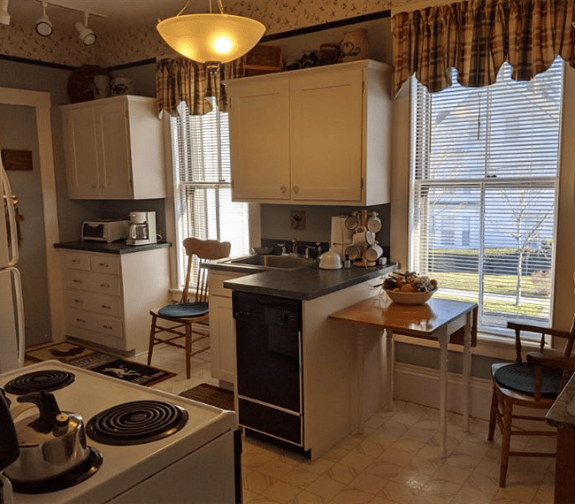 Full Kitchen with full sized refrigerator, stove/oven, dishwasher, toaster oven and microwave.  All cooking utensils and dishware provided.